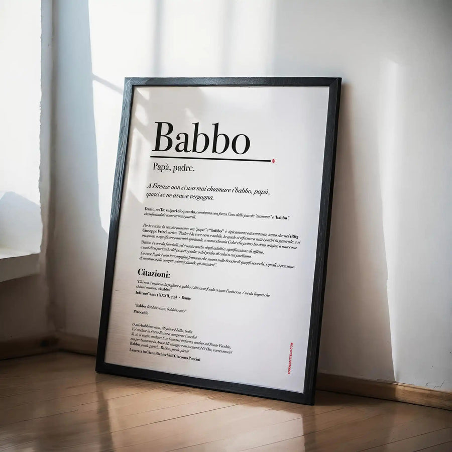 Poster «Babbo» con la spiegazione della parola, in cornice nera appoggiata accanto al letto